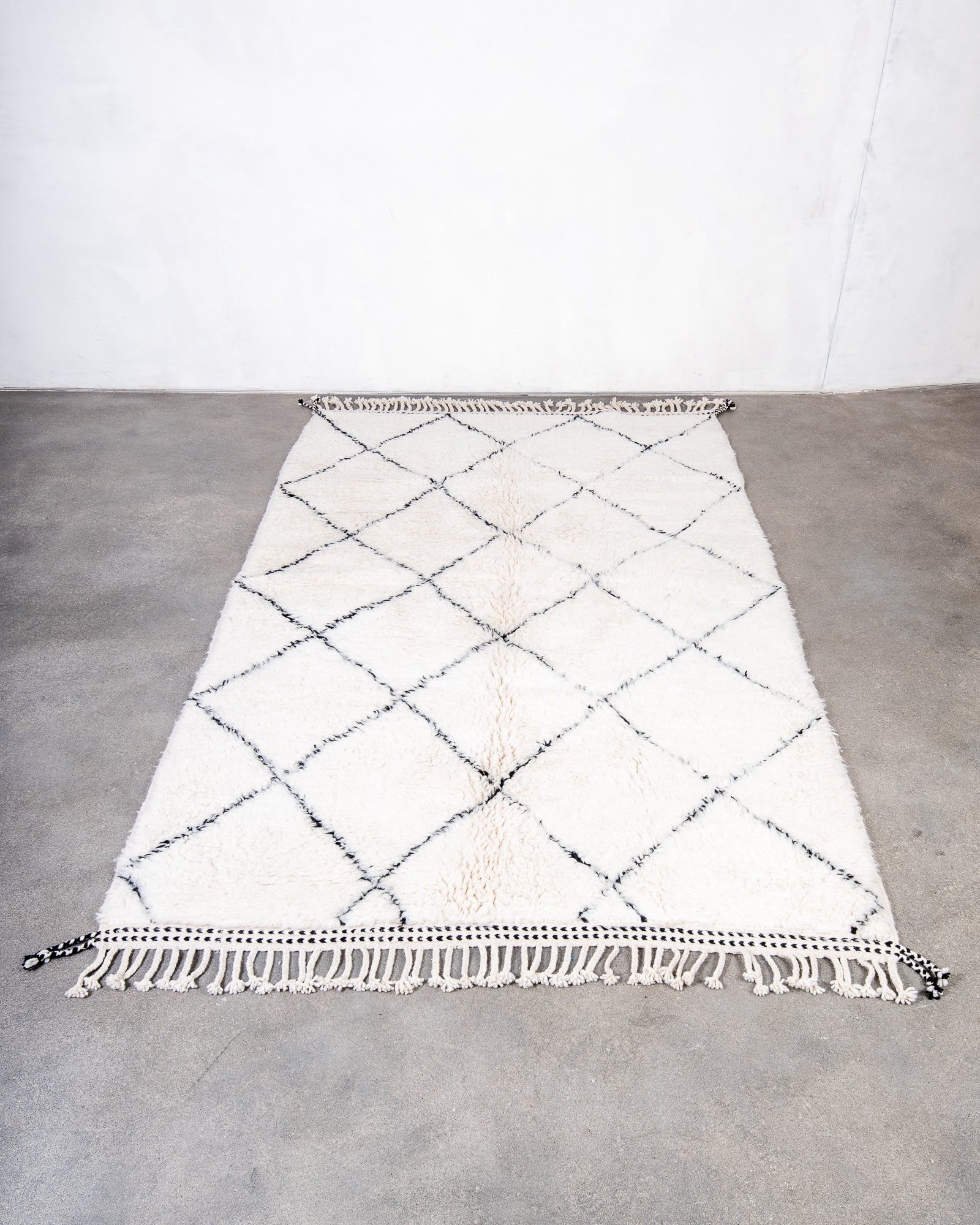Modern, designer, handcrafted Berber rug from Morocco. Beniourain carpet with beautiful colours and patterns and fluffy wool texture.